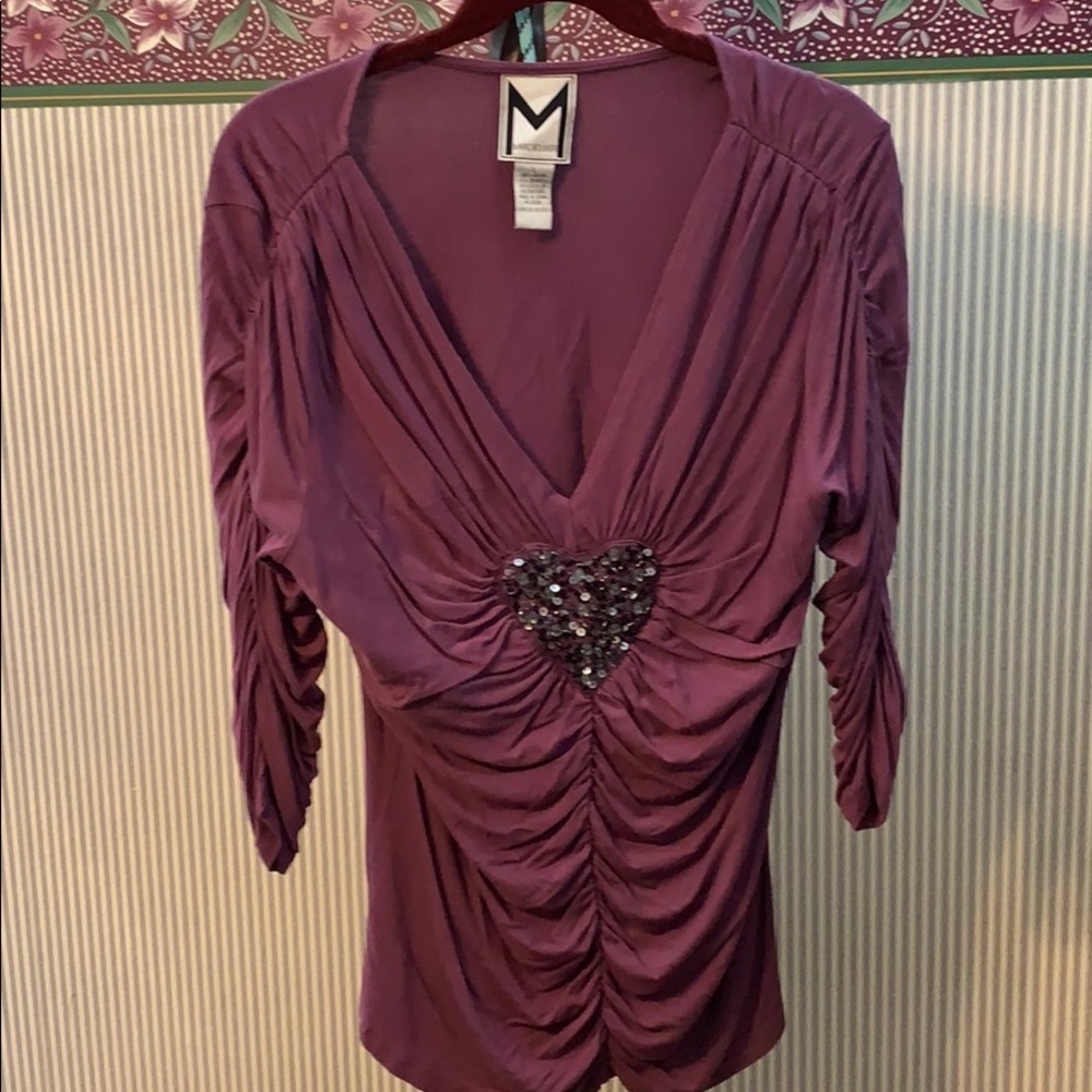 A Beaded Heart plunging neck line evening top.